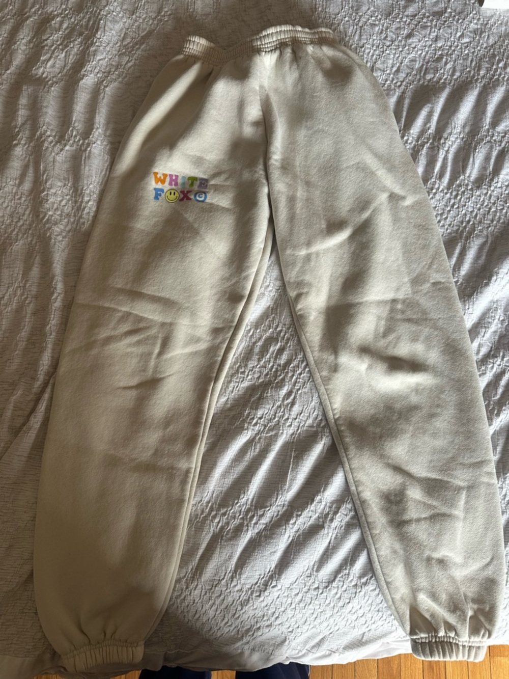 White Fox Boutique Cream Track Pants with Colorful Logo